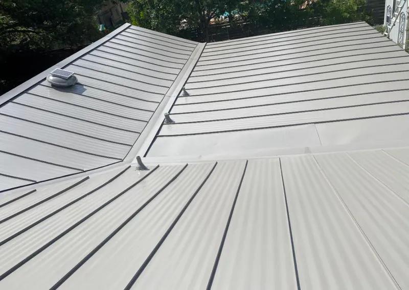 Solar attic fan installed on a metal roof for Roof Ventilation in Security-Widefield